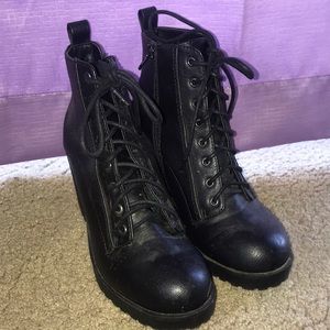 Black heeled booties with side zipper